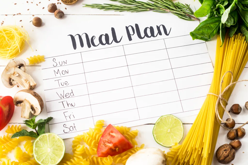 A calendar on the table with the text 'meal' plan