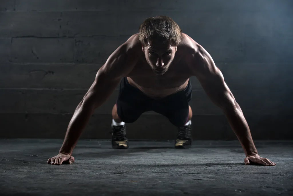 A muscular man doing push-ups